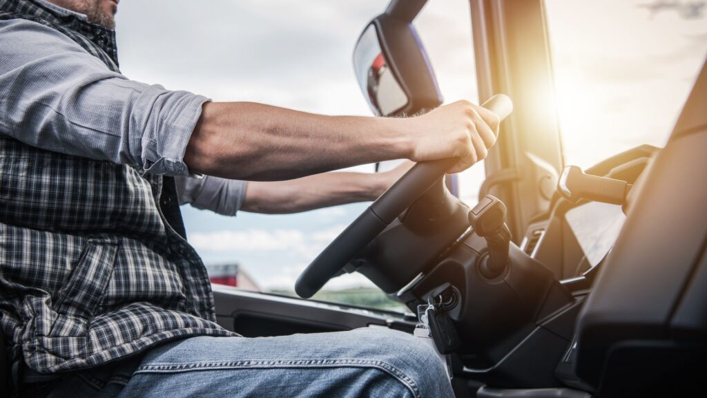 Semi-truck driver behind the wheel